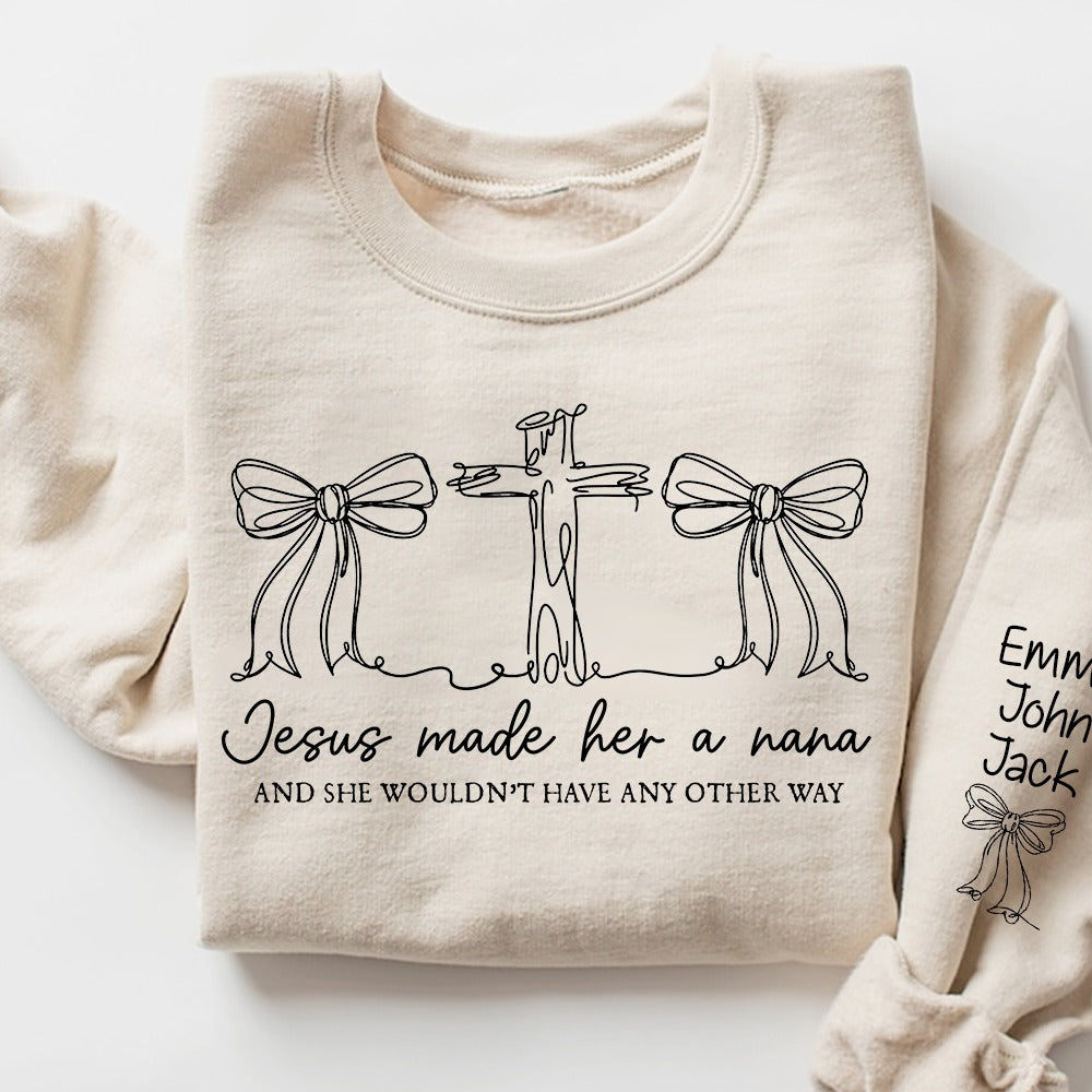 Custom Jesus Made Her A Nana Sweatshirt‑Personalized Christian Faith Crewneck With Grandkids Names On Sleeve, Cross And Bow Graphic Religious Gift for Nana, Mimi, Grammy